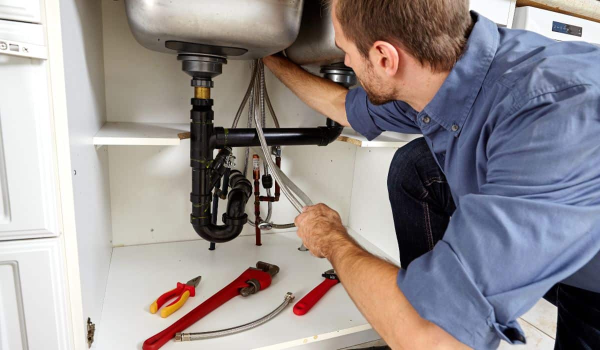 Plumber Fixing Sink