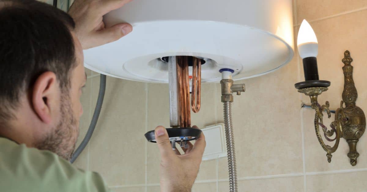 Plumber Checking Heater in Boiler