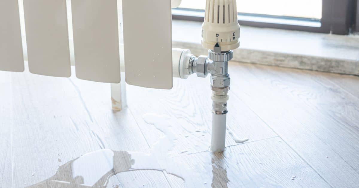 Water on the floor close to heater