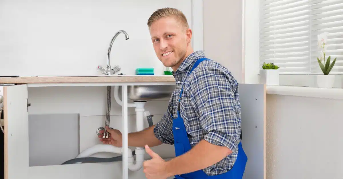 Plumber reparing sink