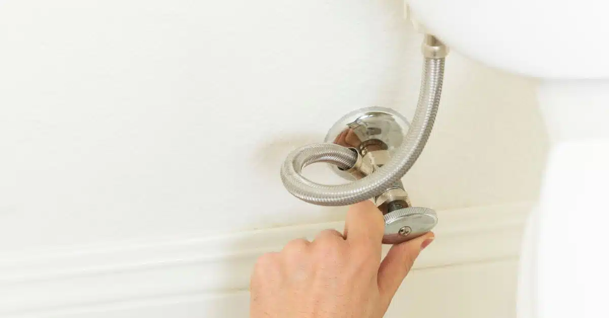 Turning off water supply valve behind toilet to fix a leaking toilet cistern