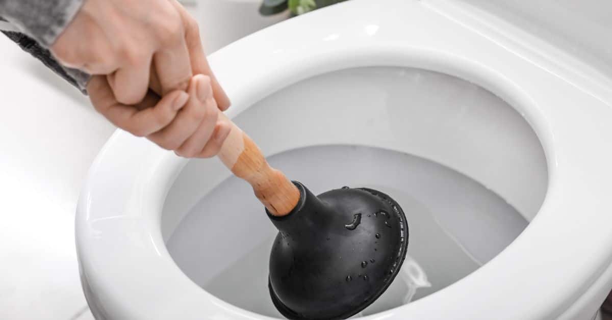 man with plunger