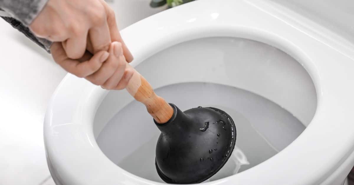 Man using a plunger