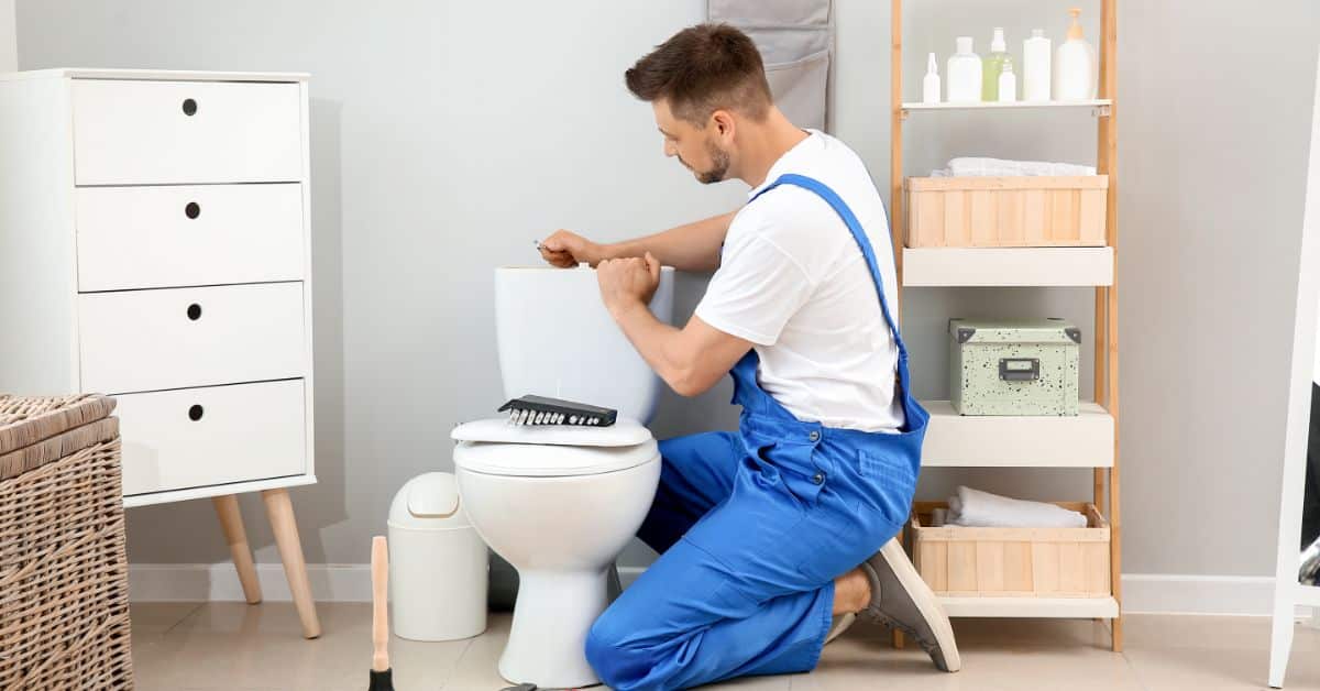 Professional Plumber doing repair work
