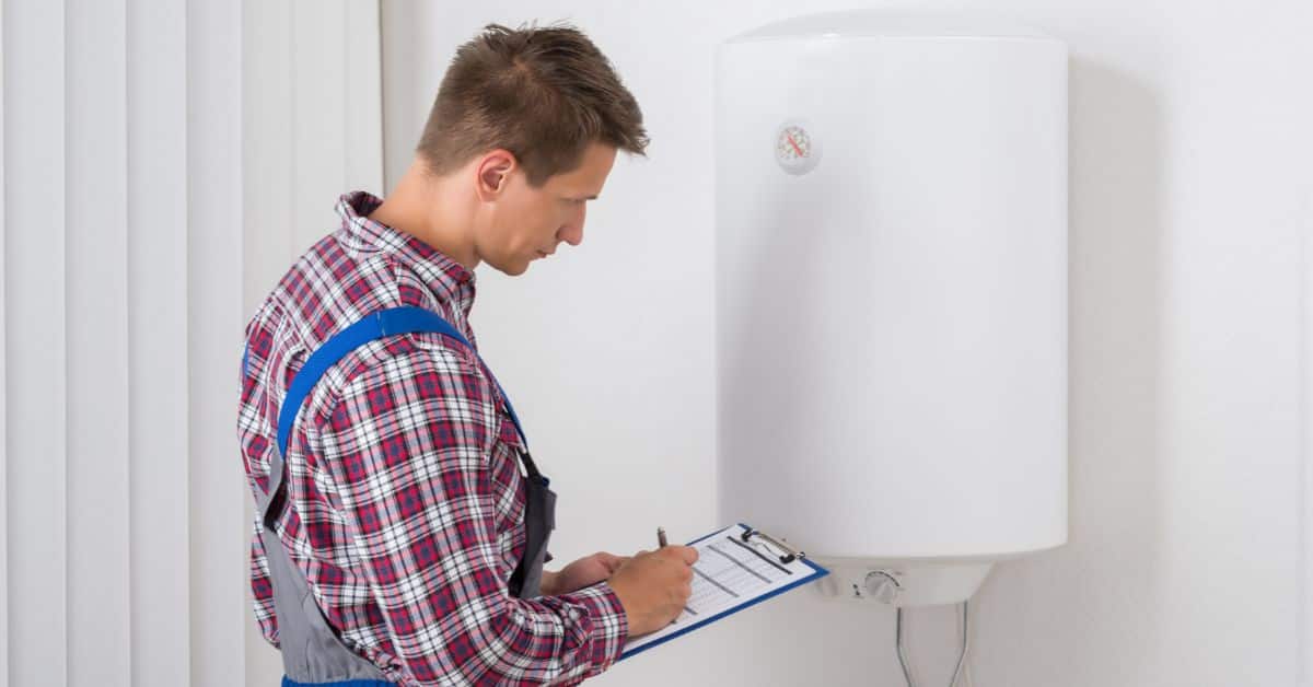 Plumber looking at boiler