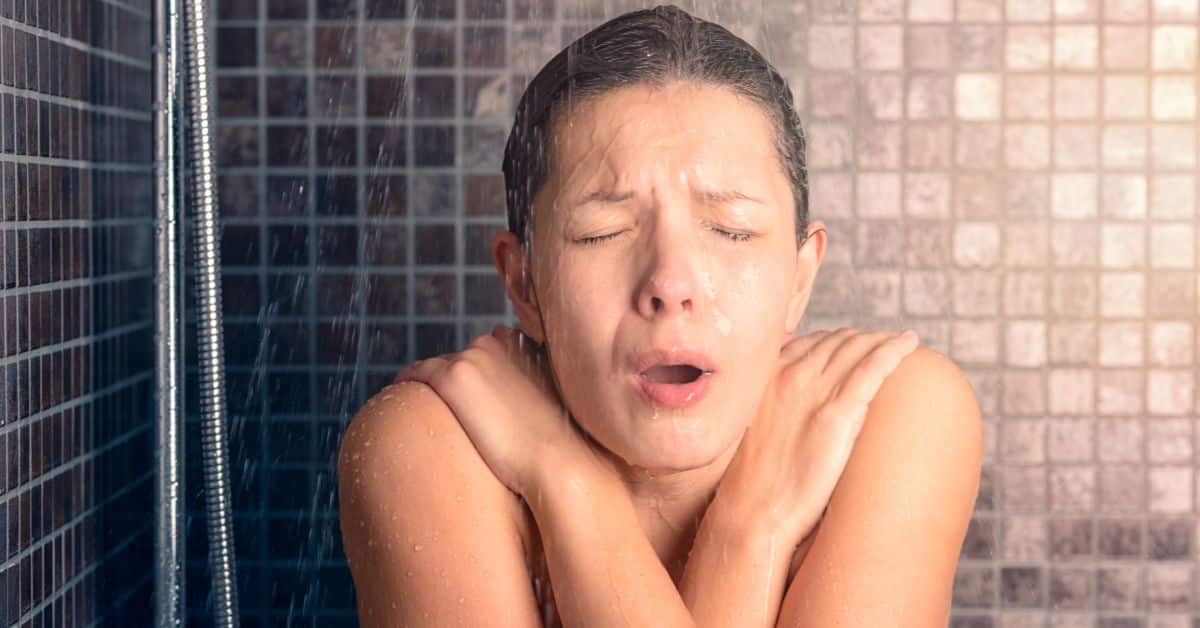 Lady having a cold shower