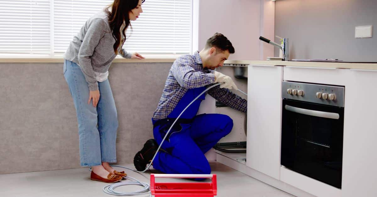 drainage service near me - Plumbing checking a clients drain