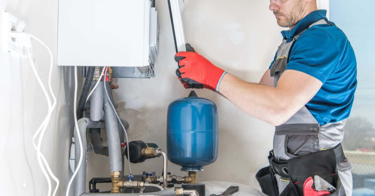 gas servicing - plumber looking at a gas boiler