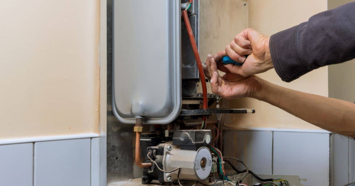 Man repairing a boiler