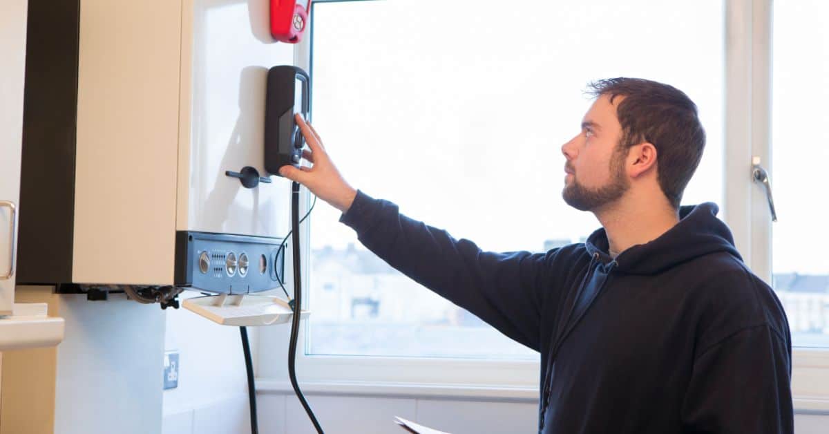 emergency heating engineer near me - checking out boiler