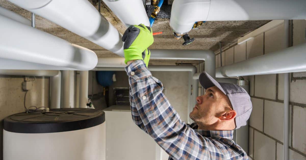 Plumber doing Boiler Pipe Maintenance