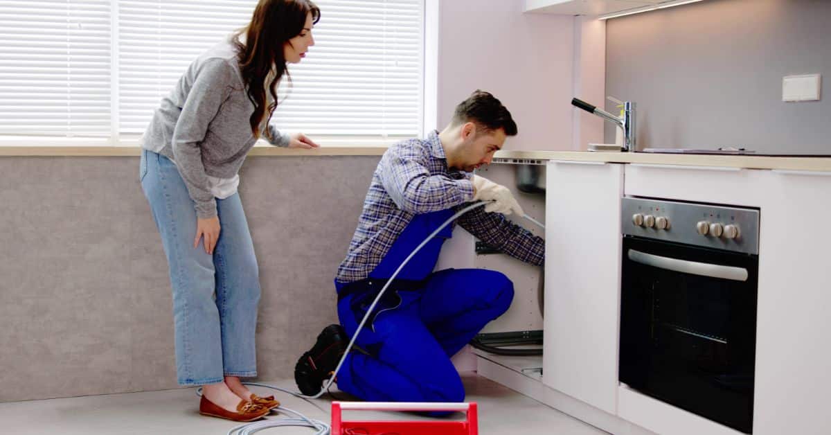 drain cleaning - Plumber and Client