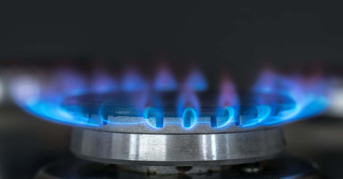 Blue flame burning from hob