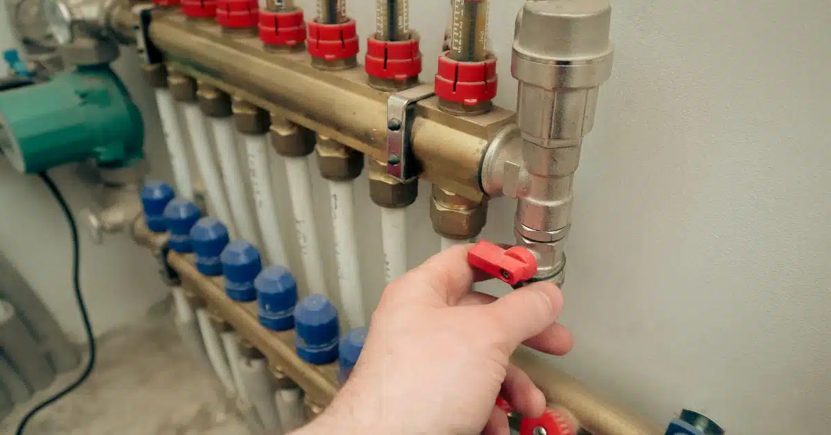 Man touching a heating valve