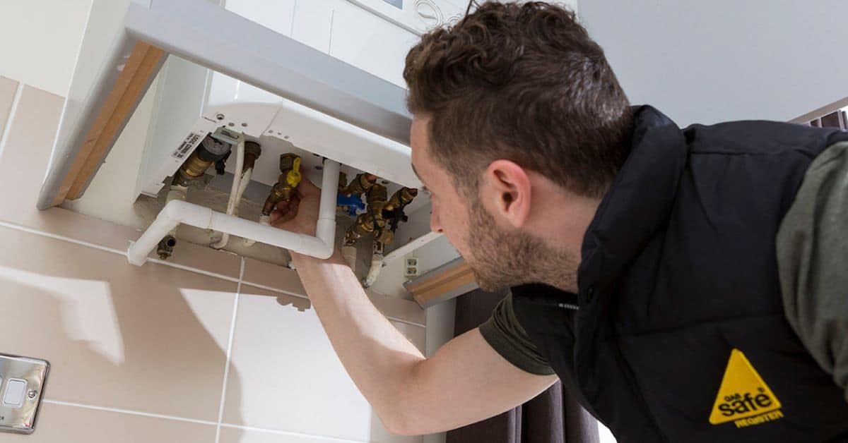 Gas Safe Plumber doing a boiler inspection