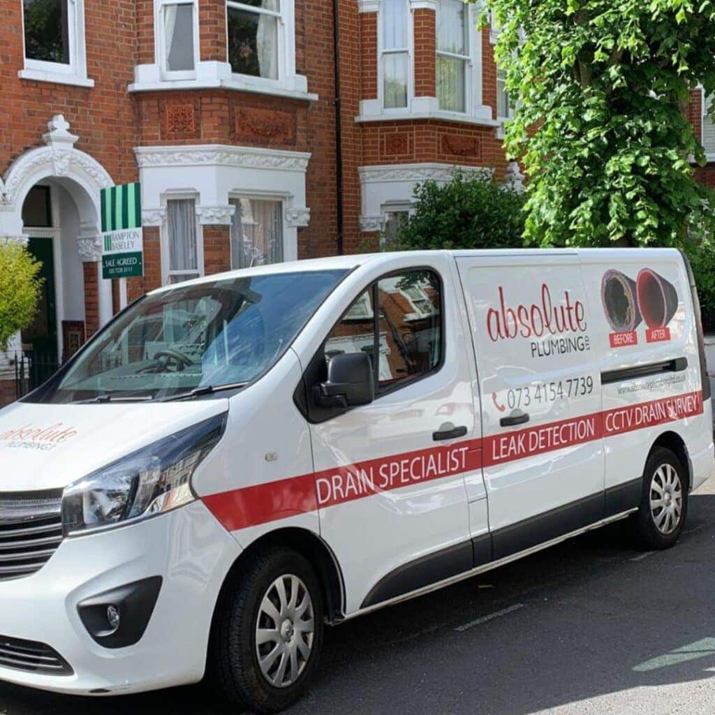 Absolute Plumbing LTD Van outside a residence