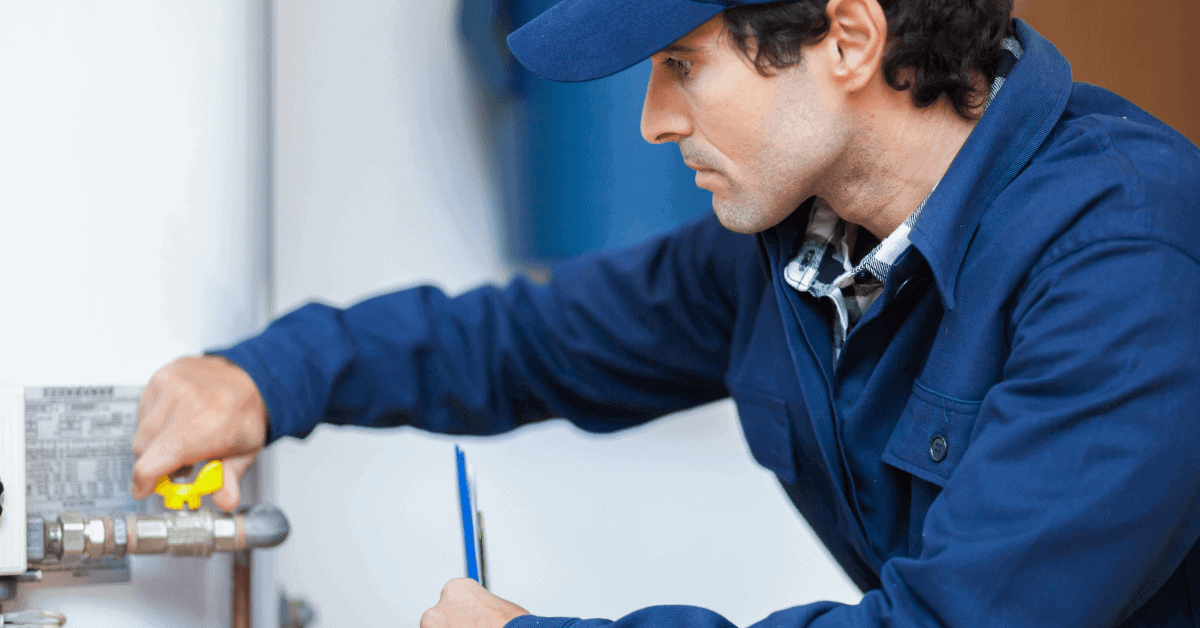 Plumber looking at a water heater