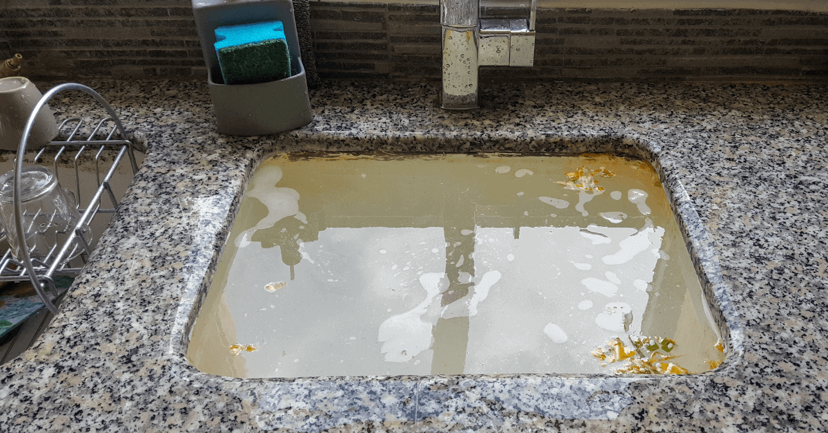 Blocked kitchen drain caused by grease build-up 