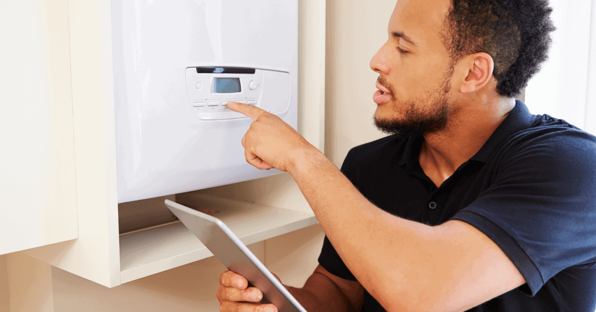 Homeowner pointing at boilers digital display 