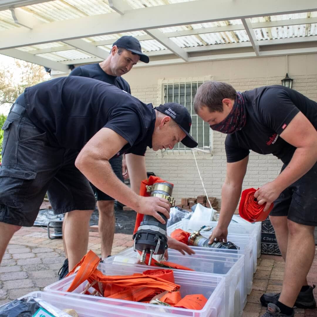 Absolute Plumbing Team setting up a drain lining project