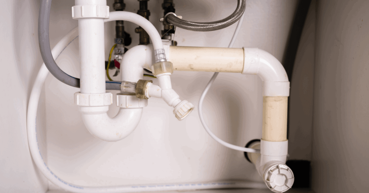 Older kitchen sink pipework with rigid plumbing connections 